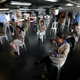 Employees of the leather manufacturer Mario Hernandez take a snack break at distance from each other amid the new coronavirus in Bogota, Colombia, Friday, May 15, 2020. Mario Hernandez is a company that meets social distancing and general health care requirements, allowing it to remain open amid the COVID-19 pandemic and lockdown. (AP Photo/Fernando Vergara)